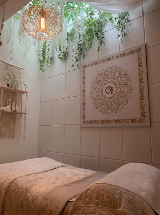Rachel Serban’s treatment room at Leamington Health Club, Leamington Spa, with mandala artwork and hanging greenery